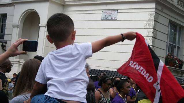 Child with notting hill flag